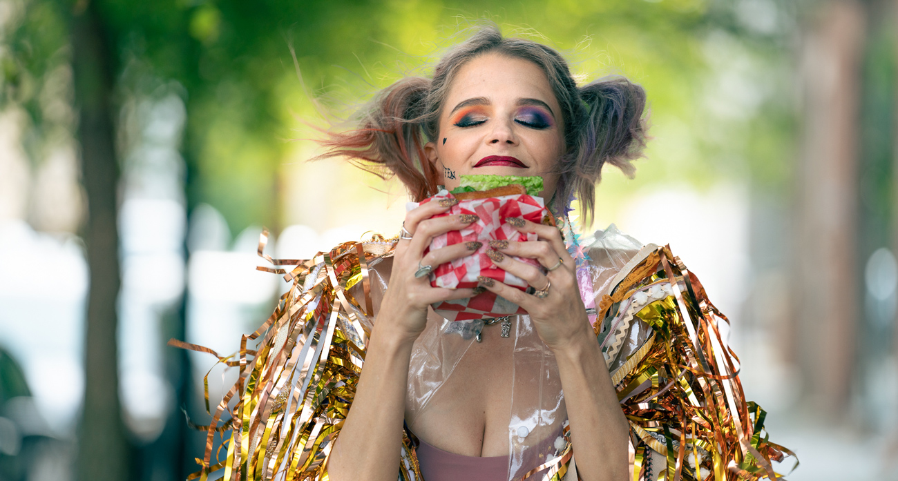 Harley Quinn Photo shoot, eating a crab cake sandwich